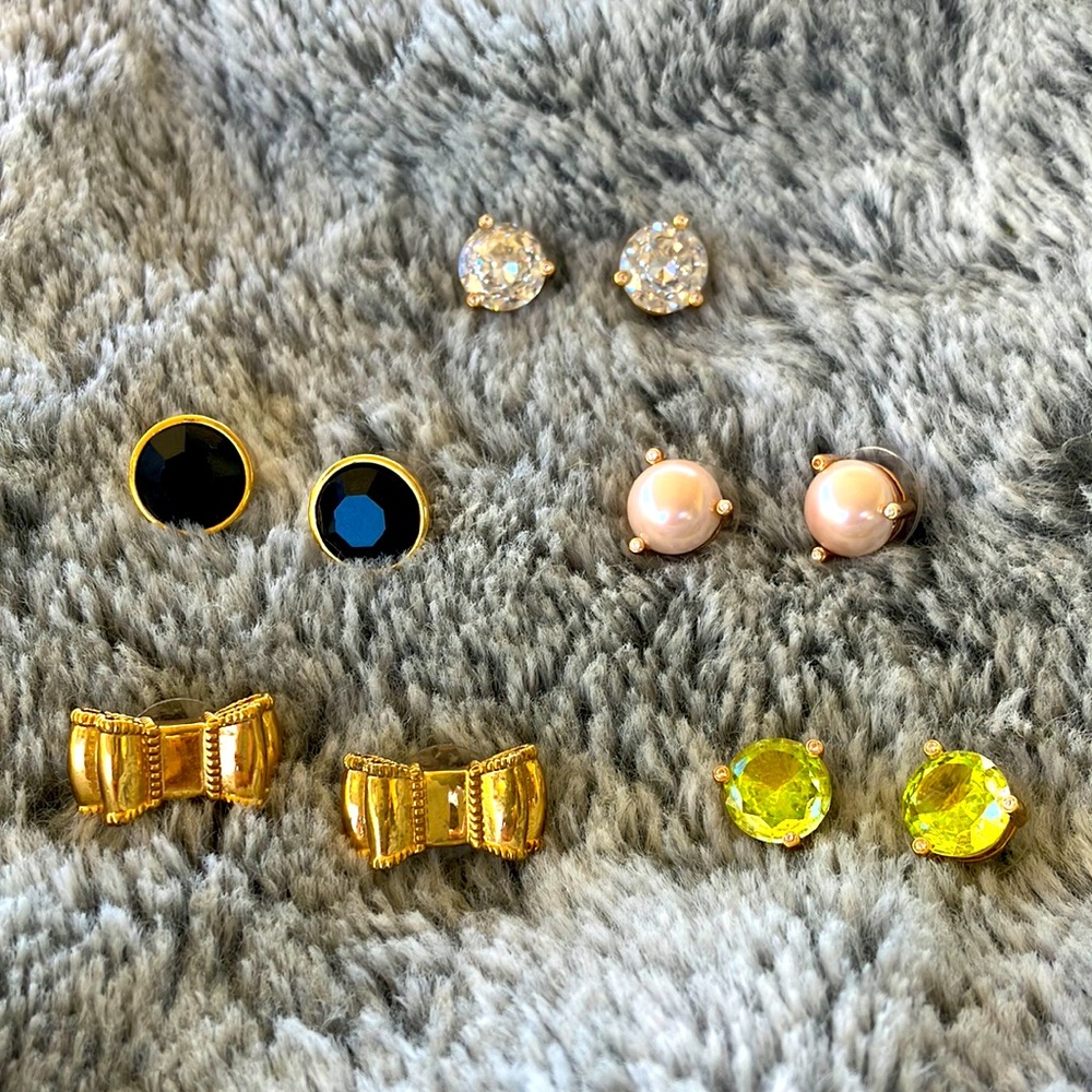 Kate Spade assorted earrings, sold as a set. Studs, set of bows and faux pearls.